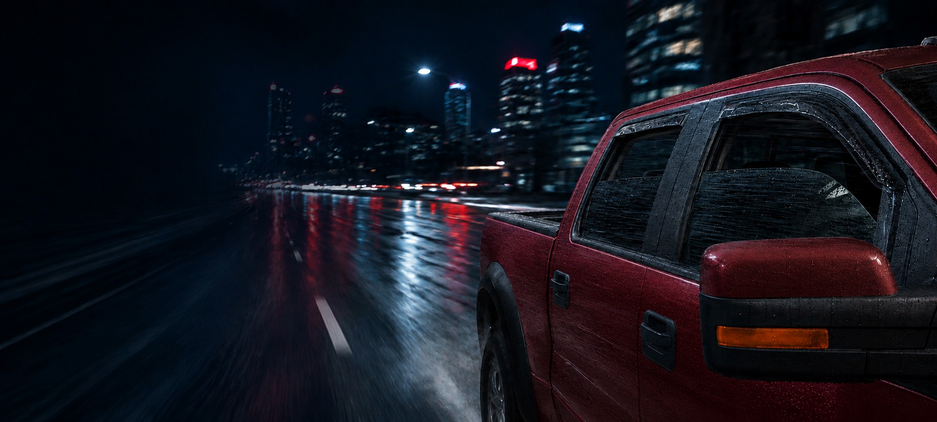 A Voron Glass-equipped pickup truck driving through the city at night