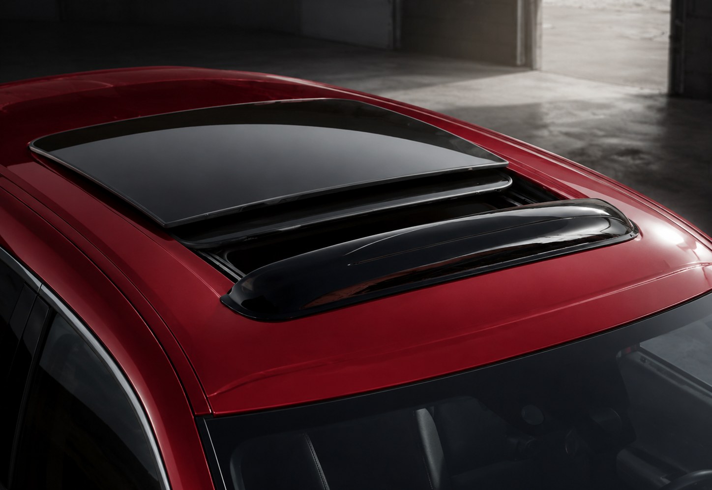 Sunroof deflector installed on a vehicle roof