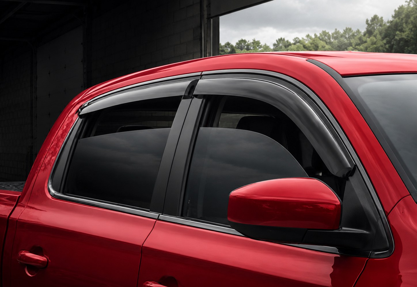 Tape-On window deflector installed on a pickup truck
