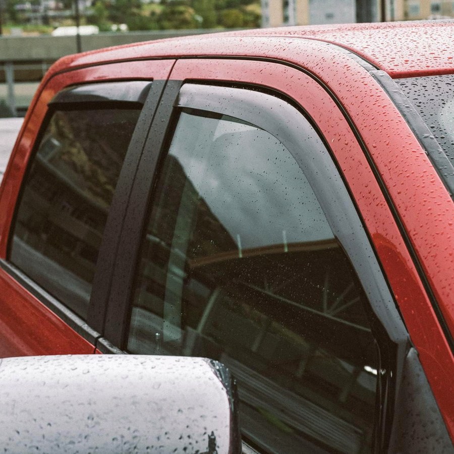 In-channel deflectors keeping rain off a slightly open window