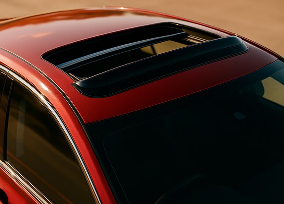 Sunroof deflector seen from above, following the curve of the roof